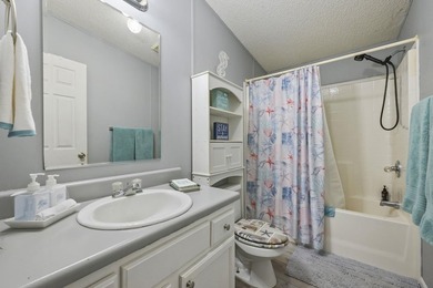 Welcome to 6043 East West Way, an inviting coastal home nestled - photo 11