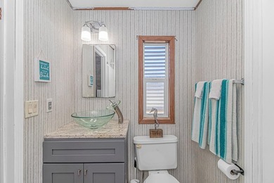 Welcome to 6043 East West Way, an inviting coastal home nestled - photo 15