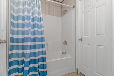 Welcome to 6043 East West Way, an inviting coastal home nestled - photo 16