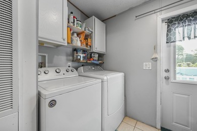 Welcome to 6043 East West Way, an inviting coastal home nestled - photo 18