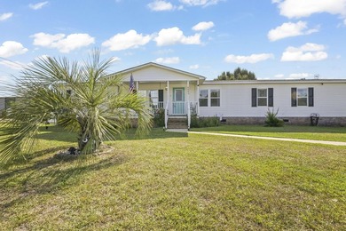Welcome to 6043 East West Way, an inviting coastal home nestled - photo 23