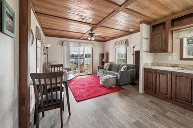 Located on the shores of beautiful Lake Higginbotham in - photo 7