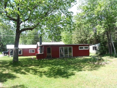 Looking for an Up North waterfront getaway with potential? This - photo 1