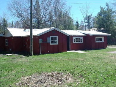 Looking for an Up North waterfront getaway with potential? This - photo 3