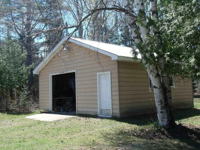 Looking for an Up North waterfront getaway with potential? This - photo 4