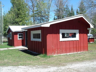 Looking for an Up North waterfront getaway with potential? This - photo 5