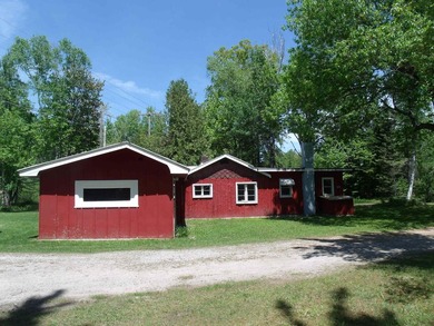 Looking for an Up North waterfront getaway with potential? This - photo 6