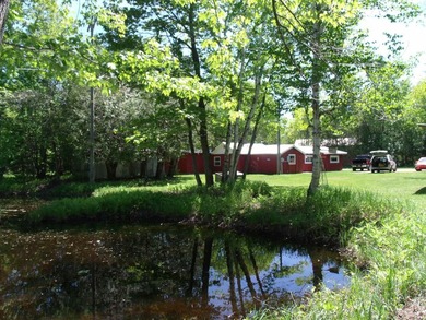Looking for an Up North waterfront getaway with potential? This - photo 9