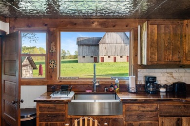 Situated on 3.37 private acres, this unique 4-bedroom, 2-bath - photo 3