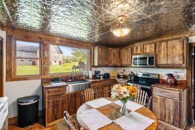 Situated on 3.37 private acres, this unique 4-bedroom, 2-bath - photo 4