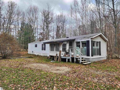 Lake Home For Sale in Weidman, Michigan