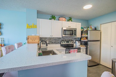 Step into this updated first-floor condo perfectly situated in - photo 8