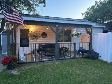 Enjoy waterfront living in this charming 2-bedroom, 1-bath home - photo 1