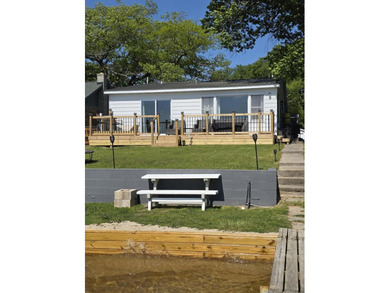 Enjoy waterfront living in this charming 2-bedroom, 1-bath home - photo 2