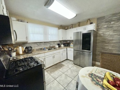 This charming home is a spacious five-bedroom, two full bath - photo 8