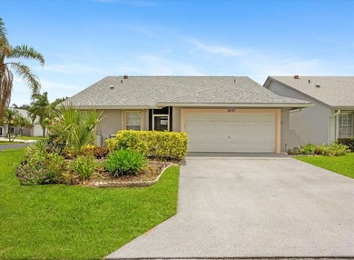 Welcome to this charming three-bedroom, two-bathroom residence - photo 1