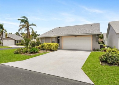 Welcome to this charming three-bedroom, two-bathroom residence - photo 2