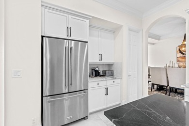 Beyond double entry doors, a remodeled iron staircase frames - photo 19