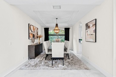Beyond double entry doors, a remodeled iron staircase frames - photo 21
