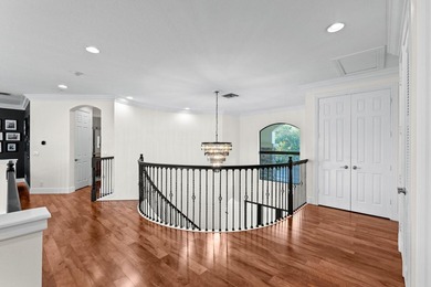 Beyond double entry doors, a remodeled iron staircase frames - photo 26