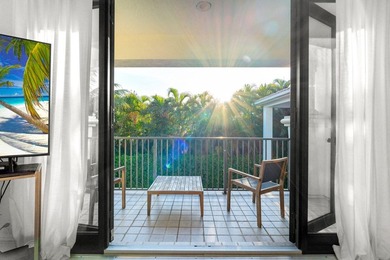 Beyond double entry doors, a remodeled iron staircase frames - photo 30