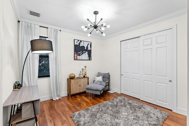 Beyond double entry doors, a remodeled iron staircase frames - photo 41
