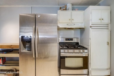 This charming Biloxi property is the perfect blend of comfort - photo 6