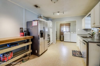 This charming Biloxi property is the perfect blend of comfort - photo 7