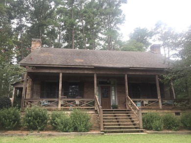 Take a leisurely drive down the picturesque driveway and be - Lake Home For Sale in Brookhaven, Mississippi