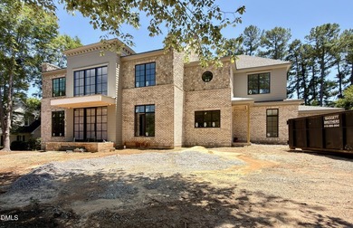 Crafted by award winning Homescapes Builders, this distinguished - photo 3