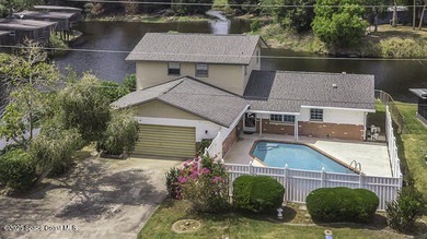 Waterfront Living with Endless Potential! Situated on navigable - photo 24