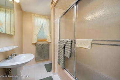 THIS TWO FAMILY HI-RANCH OFFERS A 3 BEDROOM MASTER PLUS A ONE - photo 13