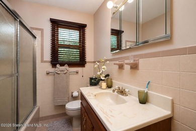 THIS TWO FAMILY HI-RANCH OFFERS A 3 BEDROOM MASTER PLUS A ONE - photo 28