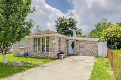 This 1950s ranch bungalow offers four bedrooms and two full - photo 1