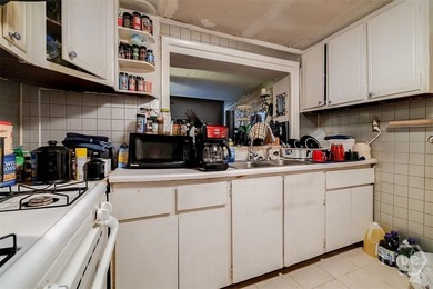 This 1950s ranch bungalow offers four bedrooms and two full - photo 8