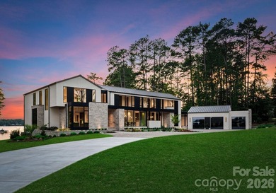 Private by design. Defined by the lake. Behind private gates and - photo 2