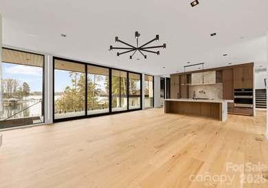 Private by design. Defined by the lake. Behind private gates and - photo 5