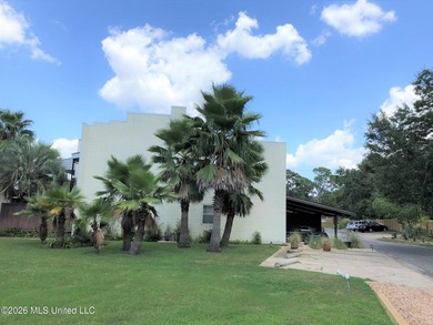 Located within the gated Colony Park Condominium community, this - photo 3