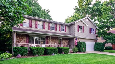 Nestled on a private 1/2 acre wooded lot in the desirable - photo 1