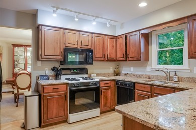 Nestled on a private 1/2 acre wooded lot in the desirable - photo 3