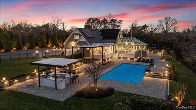 Set beyond a gated driveway and surrounded by mature landscaping - photo 2