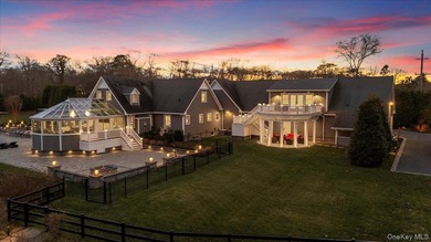 Set beyond a gated driveway and surrounded by mature landscaping - photo 3