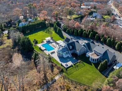 Set beyond a gated driveway and surrounded by mature landscaping - photo 4