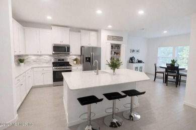 This 4-bedroom, 2-bath home features a spacious open layout - photo 5