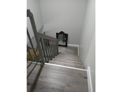 Centrally located large townhome with tile on 1st floor, wood on - photo 15
