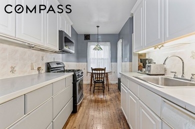 A rare opportunity to own a landmarked 1920s brick townhouse in - photo 6