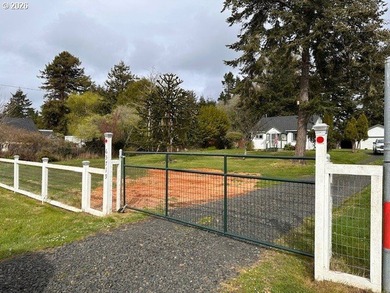Nearly one-acre level setting with a charming white fence entry - photo 9