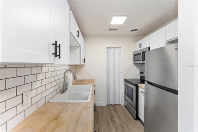 This beautifully updated concrete block home has been - photo 10