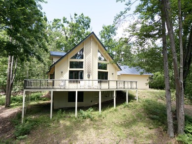 Step into this warm and inviting 3-bedroom, 2-bath chalet - photo 1