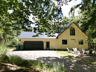 Step into this warm and inviting 3-bedroom, 2-bath chalet - photo 2